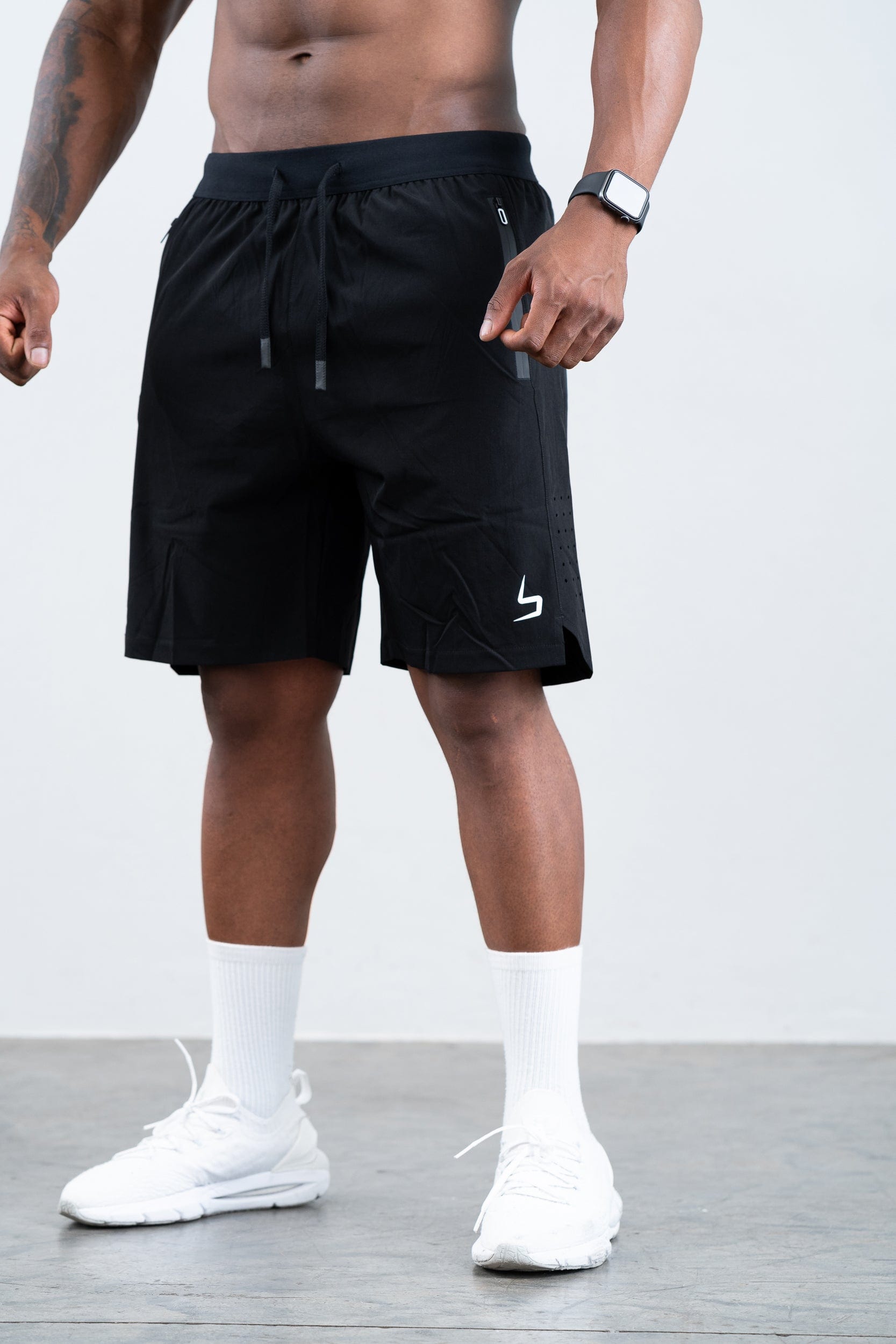 man wearing botthms black training sport short